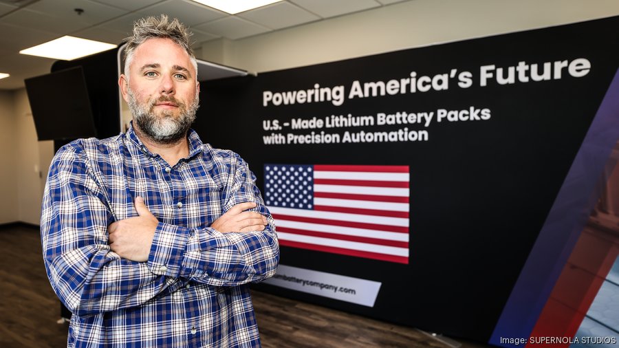 Nathan Staron as CEO in front of an American lithium battery manufacturing display